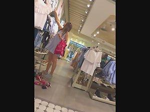 Upskirt of sweet ass in clothes store Picture 3