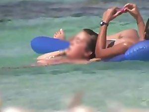 Topless sisters spied on an air mattress