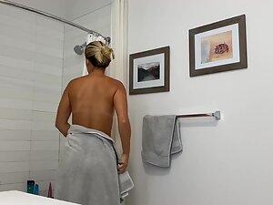 Spying on perfect naked girl with tan lines in bathroom Picture 1