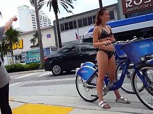 Hot teen in bikini on bicycle