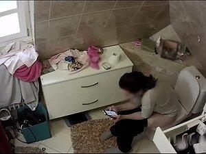 Hidden cam caught aunt watching porn and masturbating in toilet Picture 7