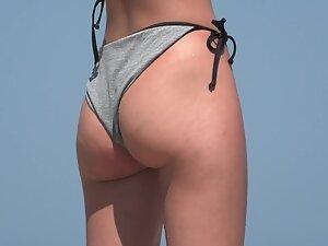 Hot ass in thong bikini and a topless friend on the beach Picture 4