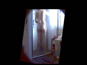 Curvy teen girl filmed under a shower Picture 3