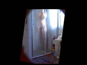Curvy teen girl filmed under a shower Picture 4