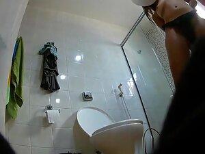 Spying on hot cousin putting a bikini on in bathroom Picture 1