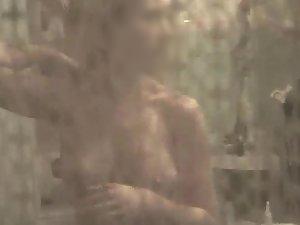 Peeping on girl's tits while she grooms