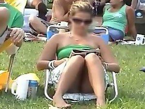 Bulging pink panties spied while she sits Picture 1