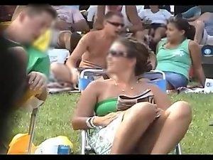 Bulging pink panties spied while she sits Picture 5