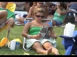 Bulging pink panties spied while she sits Picture 7