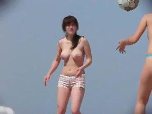 Topless girls playing beach volley ball Picture 4