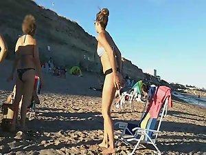 Spying a bent over beach babe Picture 6