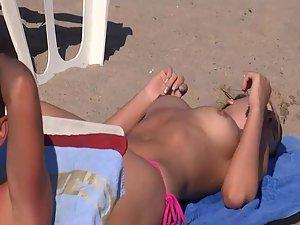 Seductive topless girls on a beach Picture 7