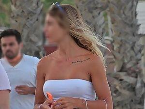 Beautiful girl got hard nipples while she walks with her boyfriend Picture 1
