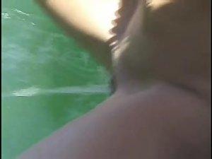 Fun loving girl pissing from a boat Picture 2