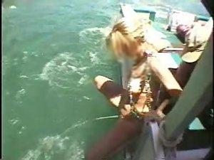 Fun loving girl pissing from a boat Picture 8