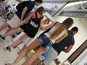 Tall teen girl's butt slips out of shorts Picture 1