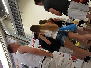 Tall teen girl's butt slips out of shorts Picture 3