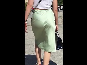 Hot ass cheeks and thong seen through skirt