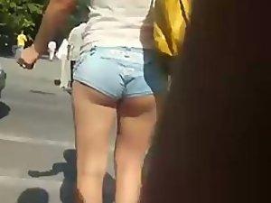 Creeping a girl with tucked in hot pants Picture 1
