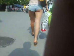 Creeping a girl with tucked in hot pants Picture 3