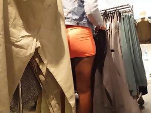 Mighty black booty in tight orange miniskirt Picture 3
