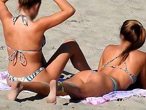 Two amazing teen girls bending over on beach Picture 7