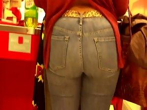 Mature woman's butt at a cash register Picture 2