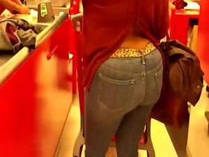 Mature woman's butt at a cash register Picture 5