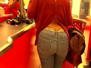 Mature woman's butt at a cash register Picture 7