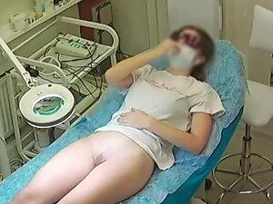Young woman gets a hair removal treatment
