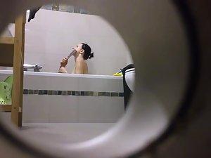 Peeping on her shower through a hole Picture 2