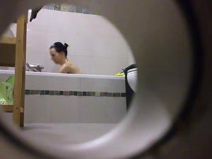 Peeping on her shower through a hole Picture 3