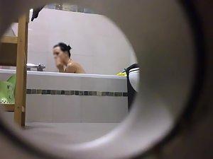 Peeping on her shower through a hole Picture 4