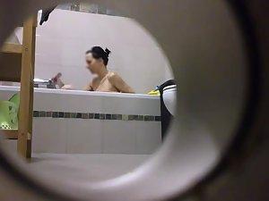Peeping on her shower through a hole Picture 5