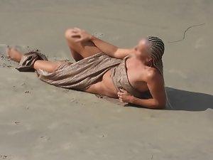 Strong naked woman with braided hair at beach Picture 2