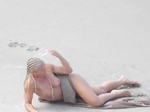 Strong naked woman with braided hair at beach Picture 5