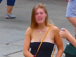 Fantastic big boobs almost slipping out of top