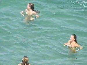 Teen nudist trio enjoying the water waves Picture 1