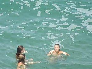 Teen nudist trio enjoying the water waves Picture 3