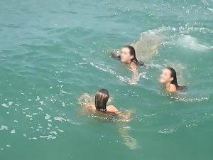 Teen nudist trio enjoying the water waves Picture 4
