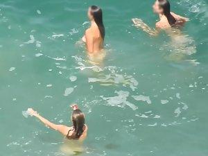 Teen nudist trio enjoying the water waves Picture 6