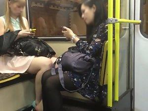 Upskirt of attractive blonde commuting in train Picture 7