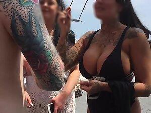Voyeur gets close to big fake boobs by the beach Picture 1