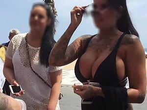 Voyeur gets close to big fake boobs by the beach Picture 2
