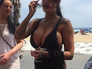 Voyeur gets close to big fake boobs by the beach Picture 3