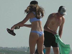 Zooming in on a very nicely shaped ass on the beach