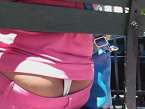 Thong peeks out from pink pants Picture 8