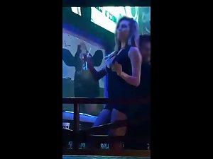 Slutty sex bomb flashing her pussy in nightclub Picture 3