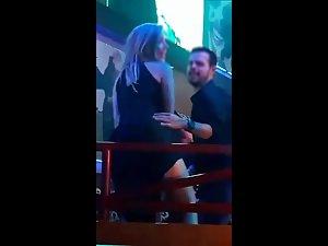 Slutty sex bomb flashing her pussy in nightclub Picture 5