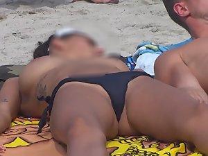 Playing with big tits on beach Picture 2